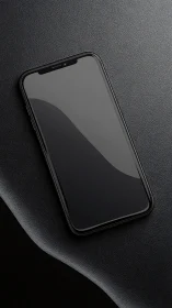 Black smartphone with notch on textured surface.