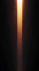 Vertical beam of warm cinematic light through darkness.