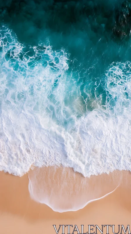 Crashing ocean waves wash gently over soft sandy shoreline.