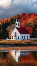 Cozy white chapel by a quiet autumn river at golden hour.