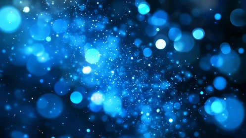 Blue bokeh particle field with scattered light points.