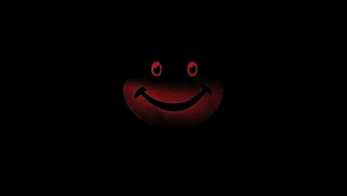 Red glowing smiley face emerging from complete darkness.