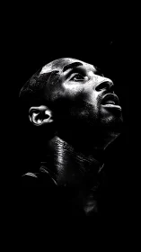 High-contrast monochrome portrait in dramatic chiaroscuro style.