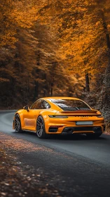 Yellow sports coupe curves through vivid autumn forest road.