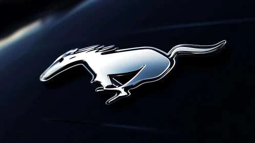 Chrome running animal emblem gleams on sleek dark surface