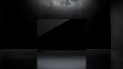 Minimalist black monitor against moody studio backdrop.