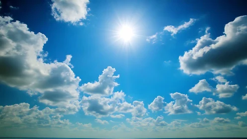 High noon sun radiates above cumulus field over marine horizon