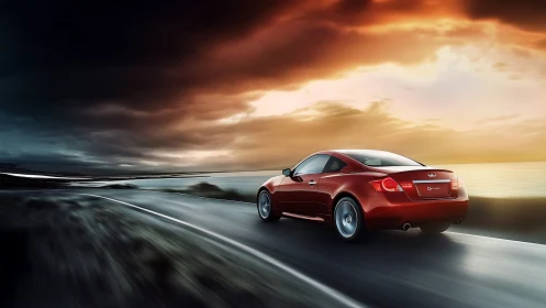 Aerodynamic red coupe accelerating along coastal highway at dusk.