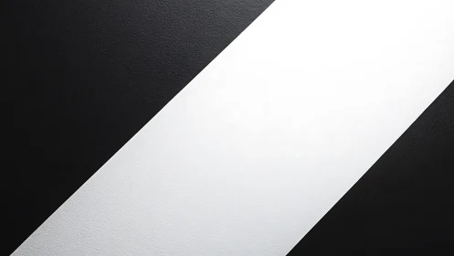 Diagonal black and white geometric bands define stark contrast