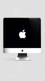 Minimalist silver desktop quietly frames a glowing logo
