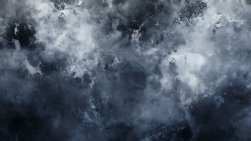 Stormy abstract cloudscape in monochrome blue grayscale.