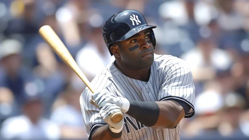Baseball batter in striped uniform swinging wooden bat.