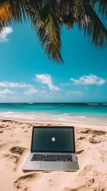 Laptop on tropical beach under palm shade at midday.