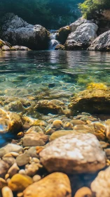 Shallow riverbed optics with upstream cascade and karst boulders.