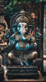 Turquoise Ganesh idol with ornate gilt crown and ritual objects