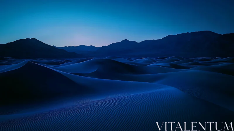 Nocturnal desert dunes render subtle gradients of twilight blue
