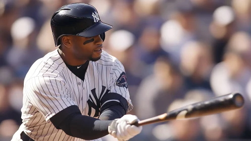 Right-handed batter in pinstripes executes focused swing.