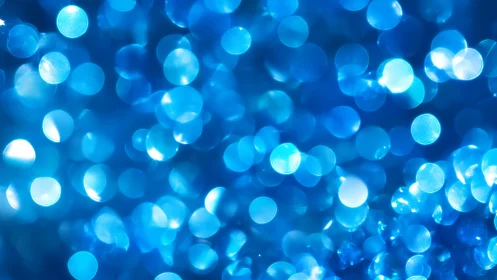 Shimmering Blue Bokeh Abstract Background with Soft Light Effects.