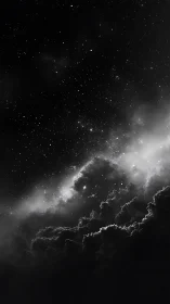 Star-laden night sky looms over luminous storm clouds