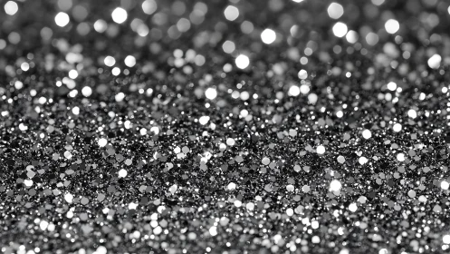 Silver glitter granules create dense reflective bokeh field