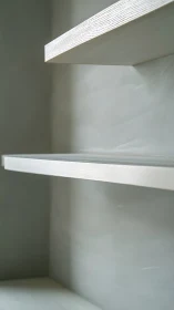 Minimalist floating shelves emphasize clean linear geometry