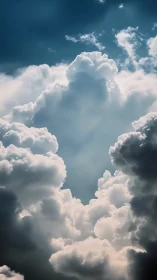 Cathedral clouds rise into a sunlit, drifting skyward gate.
