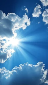 Radiant midday sunburst breaking through cumulus clouds.