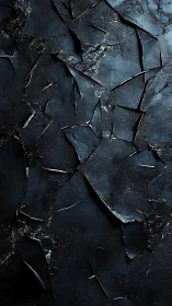 Shattered dark slate surface forms jagged abstract landscape