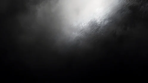 Diffuse light intersects dark textured atmospheric field