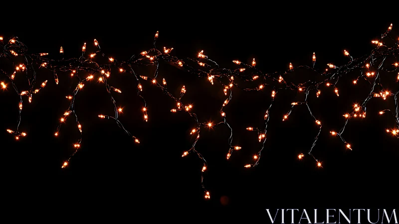 Warm amber icicle string lights suspended on black background.