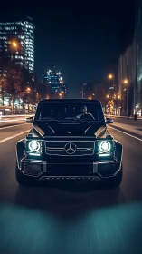 Black Mercedes SUV drives through illuminated city street