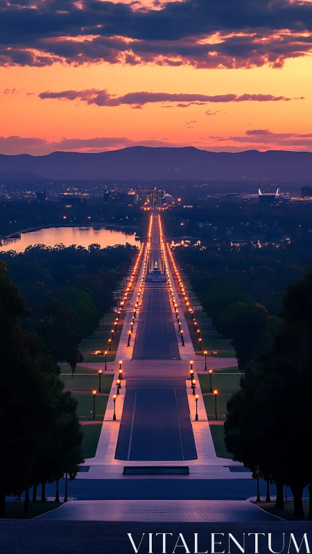 Sunset view down illuminated avenue toward distant city.