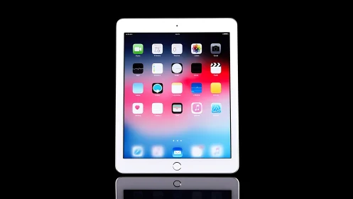 iPad displaying iOS home screen with app grid interface and dock