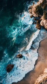 Tidal rhapsody against sunlit cliffs and caramel sand shores.