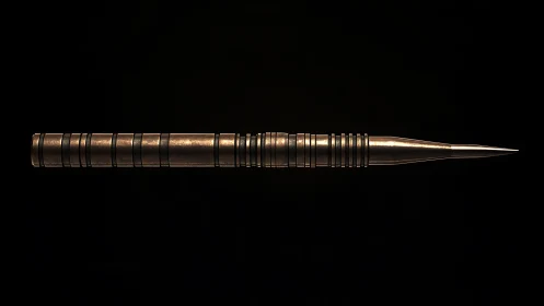 Bronze precision stylus rendered on black background.