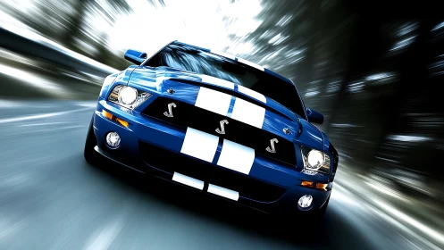 Blue striped sports coupe in forward low-angle road motion.