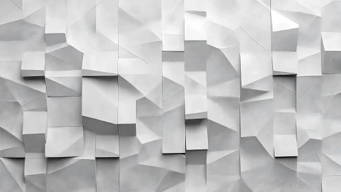 Geometric white relief wall with angular folded planes.