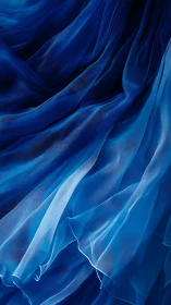 Billowing blue organza folds flow in luminous waves.