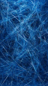 Glistening blue fibers weaving a dreamy, electric tangle.