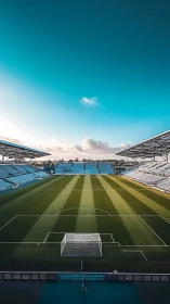 Silent stadium daydreams beneath a vast turquoise sky