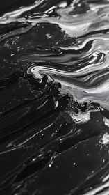 Monochrome liquid surface shows flowing marbled streaks
