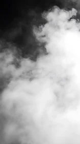 Dense white smoke cloud drifting against dark void.