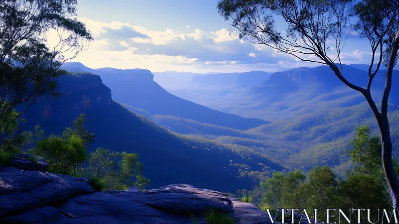 Soft morning light settles gently over misty blue valleys