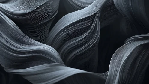 Flowing graphite ribbons in abstract monochrome motion.