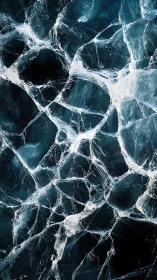 Shattered blue ice forms a dramatic crystalline surface pattern