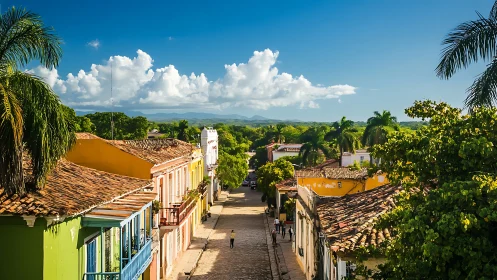 Colorful colonial street stretches toward distant mountains