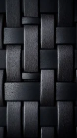 Dark woven leather texture reveals tight geometric pattern