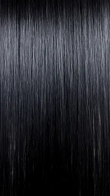 Straight wet black hair strands hang vertically in frame