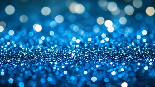 Blue glitter macro field uses shallow depth for luminous bokeh
