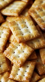 Golden rectangular crackers arranged on surface.